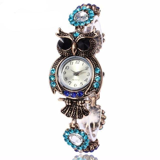 Montre-bracelet élégante en forme de hibou à quartz en acier inoxydable vintage pour femmes